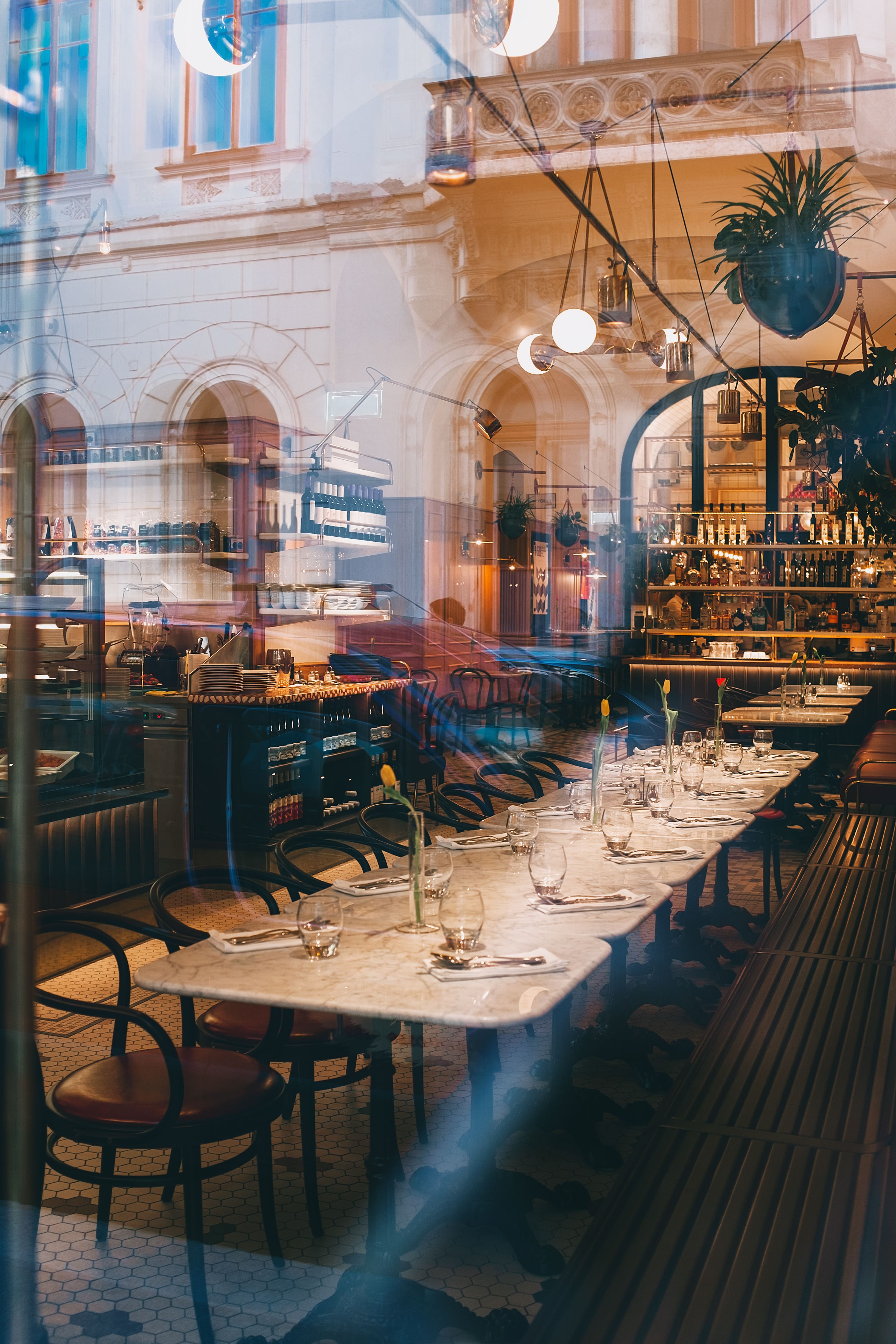 A restaurant with tables and chairs