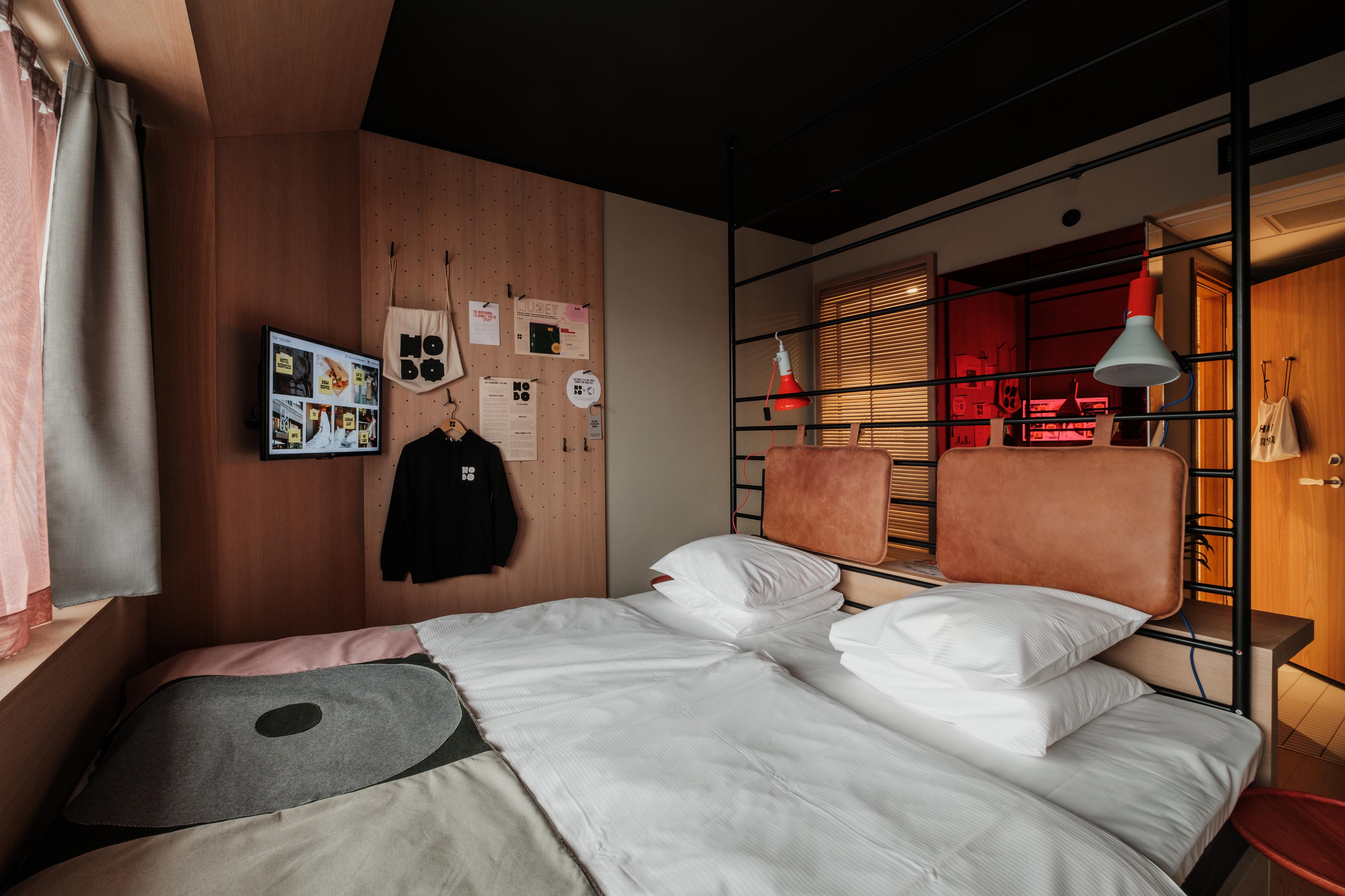 Superior room at Hobo Hotel in central Stockholm with king size bed, modern details and creative interior design.