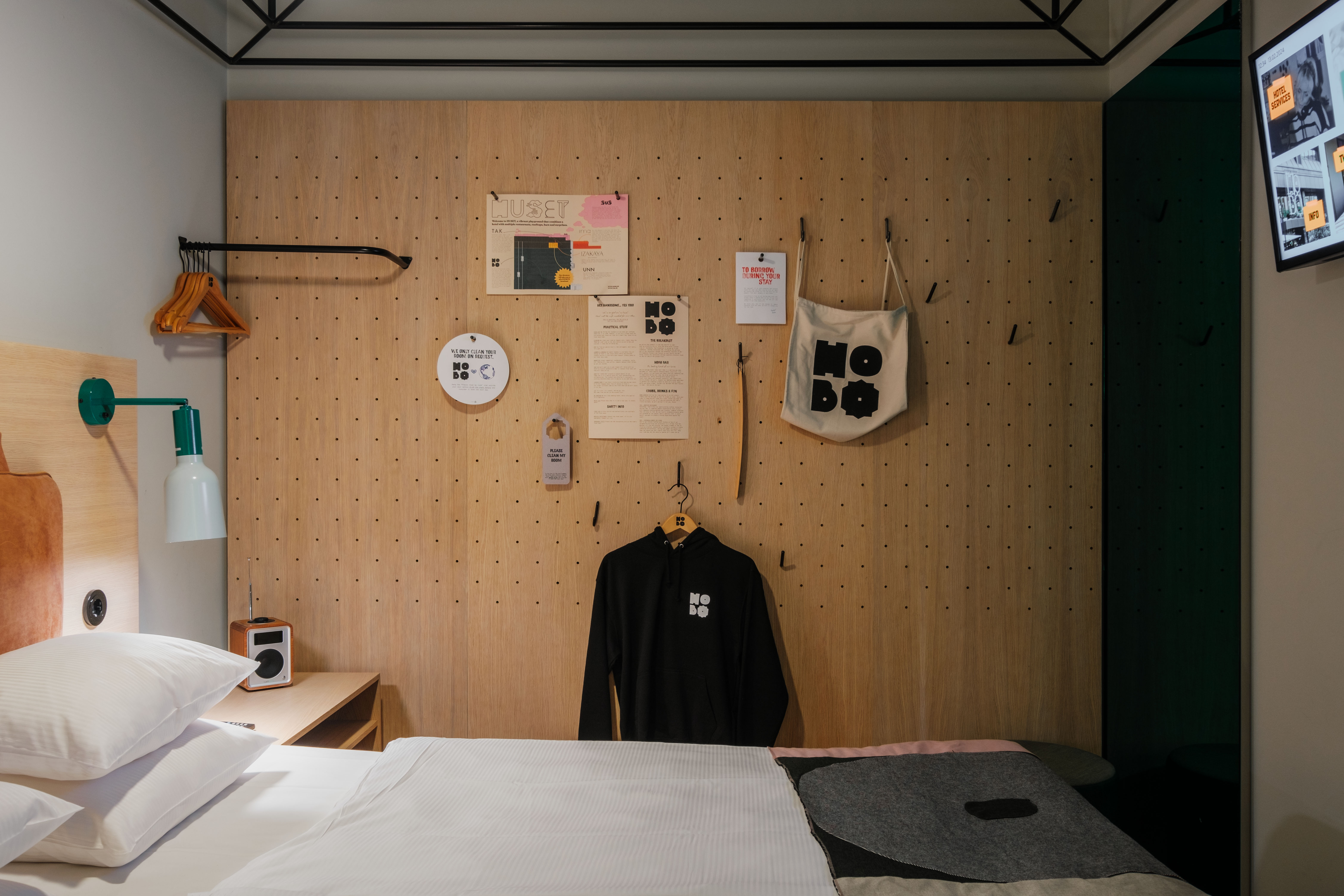 The Sleeper room at Hobo Hotel in Stockholm features modern details, creative interior design and a curated peg wall with items you can borrow.