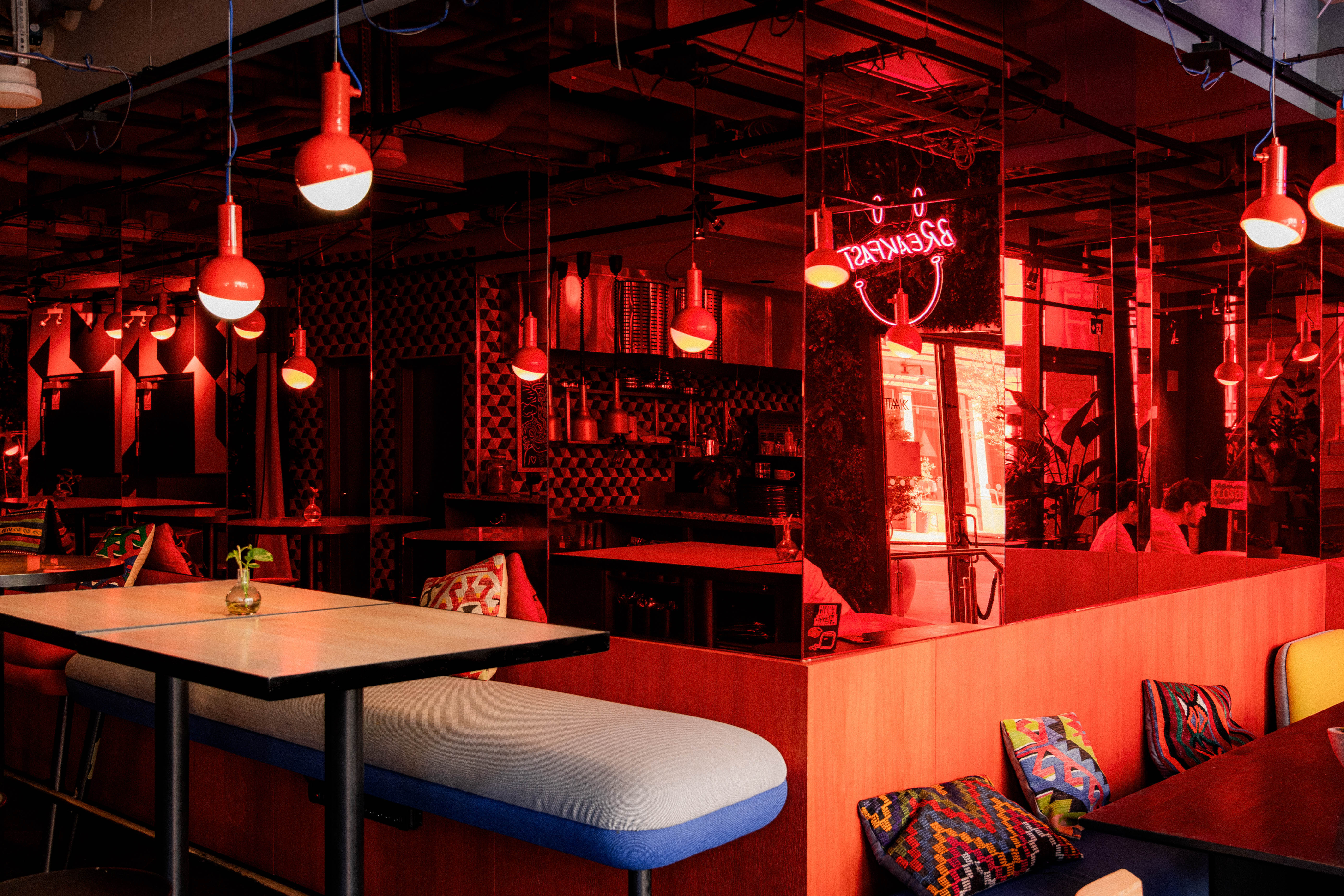 The lobby bar at Hobo Hotel in Stockholm with modern details and creative red interior design.